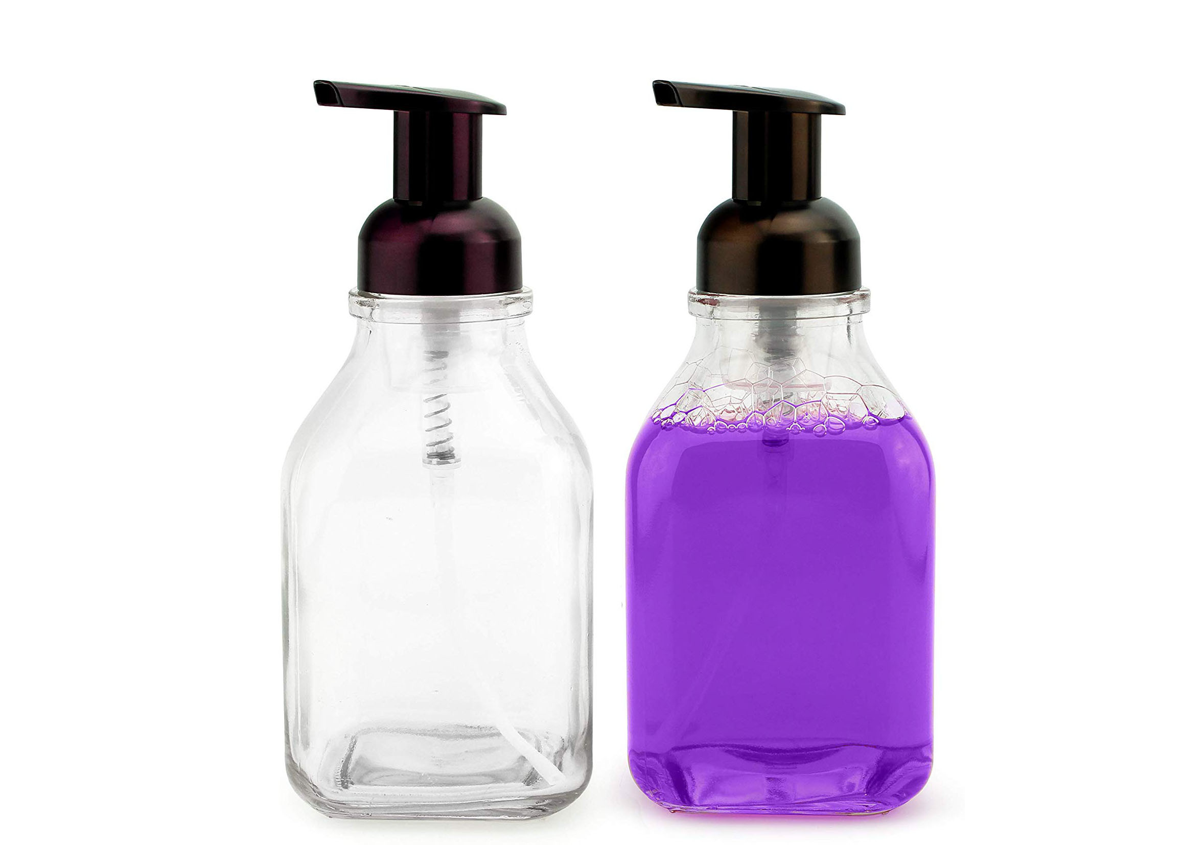 Прозрачный стеклянный пустой насос пены разливает прочную ровную поверхность по бутылкам